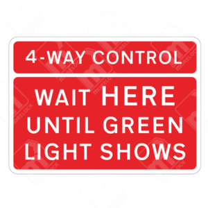 4-Way Control Wait Here Until Green Light Shows Sign – Temporary UK traffic sign instructing vehicles to stop and wait at a controlled junction.