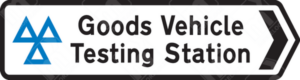 Goods Vehicle Testing Station Sign (Diagram 2802) – UK road sign directing HGVs and commercial vehicles to an official testing station for MOT and compliance checks.